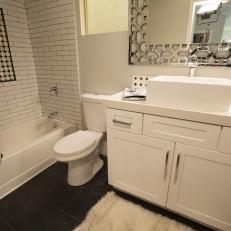 Modern Black and White Bathroom with White Tile Backsplash 