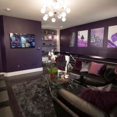 Eclectic Purple Living Room with Black Sofa and Purple Pillows 