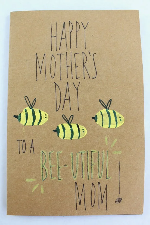 Have each kid place their thumbprint on a card, and draw designs so they resemble bumblebees. Write a "Bee-utiful" message to surprise mom with.