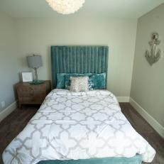 White Coastal Bedroom with Blue Headboard 