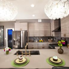 Modern Gray Kitchen with White Light Fixtures 