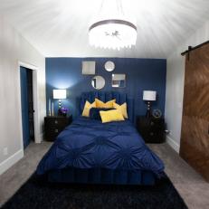 Midcentury Modern Blue Master Bedroom with Yellow Pillows 