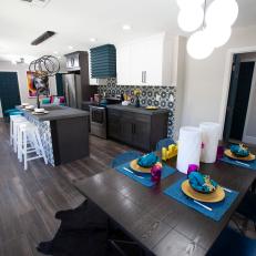 Contemporary Gray Open Plan Kitchen and Dining Room with Blue Chairs 