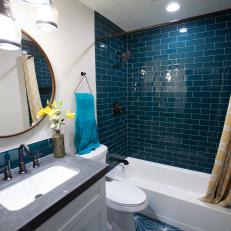 Contemporary White Bathroom with Blue Tile Shower 