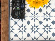 Beautiful and timelssly on-trend, cement tile adds a big punch of color and pattern to any room — but it's pricey ... and heavy. Get the same luxe look without the hefty price tag (and, well, heft!) by stenciling a board to create a gorgeous tray.