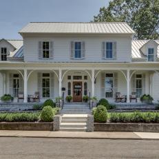 Home Exterior Featuring Large Front Porch With Rocking Chairs