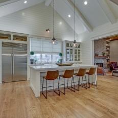 Shiplap Kitchen With Eat-In Island and Vaulted Ceiling