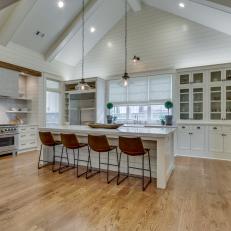 White Shiplap Kitchen With Large Eat-In Island