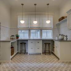 Large Laundry Area With Pendant Lights and White Cabinets