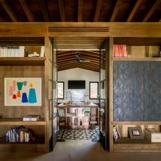 Built-In Bookshelves Frame Entrance to Contemporary Kitchen