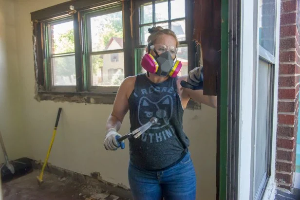 Mina Starsiak Hawk takes a window apart as she demos a home as seen on HGTV's Good Bones.