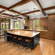 Open Kitchen With Eat-in Island and Exposed Beam Ceiling