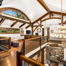 Wood Beams and Arched Windows in Loft Area