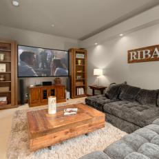 Media Room With Gray Sectional and Rustic Coffee Table
