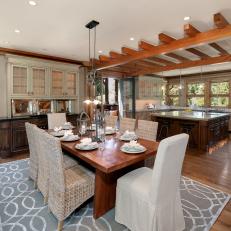 Upscale Country Dining Area With Rattan Dining Chairs