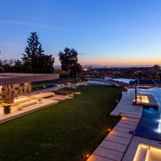 Contemporary Home With Curved Infinity-Edge Swimming Pool With Fountains