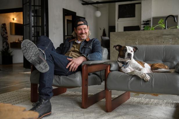 As seen on Restored by the Fords, Steve and his dog, Yoko, relax in the living room of Steve's personal apartment in Pittsburgh, PA. Steve and Leanne restored the industrial warehouse and created an urban apartment.
