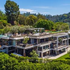 Aerial View of 3-Story Contemporary Mansion Set in Natural Landscaping