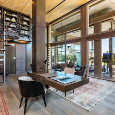 Neutral Contemporary Home Library Has Spiral Staircase