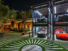 Classic Cars in Glass Two-Story Contemporary Garage