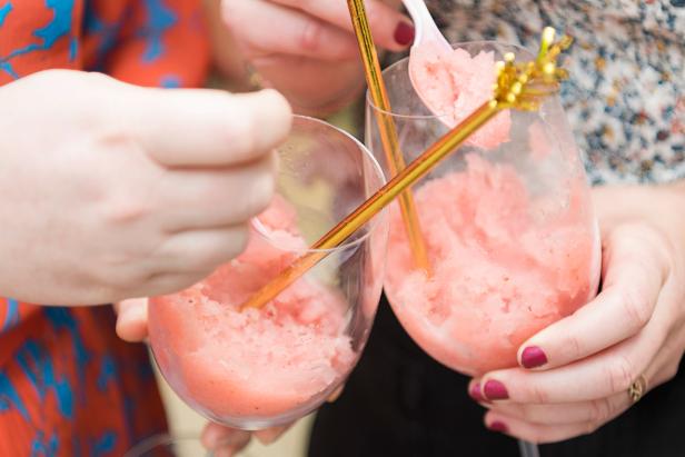 Frozen Rosé Cocktails in Wine Glasses with Gold Mixing Straws
