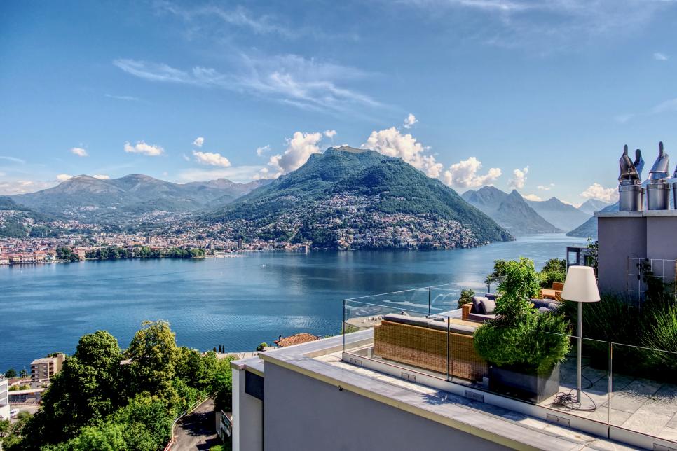 Rooftop Terrace With View Of Hillside Residences Across The Lake