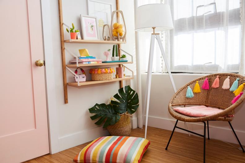 Colorful Accessories Sit on a Wood Shelf Next to a Wicker Chair