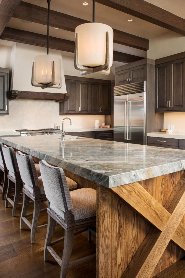 Long Granite Kitchen Island with Light Fixtures Above