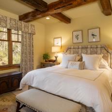 Country Bedroom with Wood Beam Ceilings