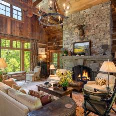 Rustic Living Room with Floor to Ceiling Stone Fireplace