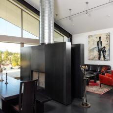 Modern Open-Concept Living And Dining Space With Double-Sided Fireplace