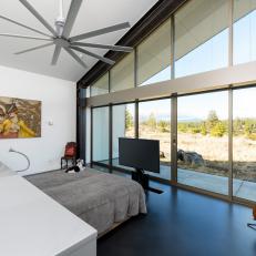 Modern Bedroom With High Ceilings And Mountain Views