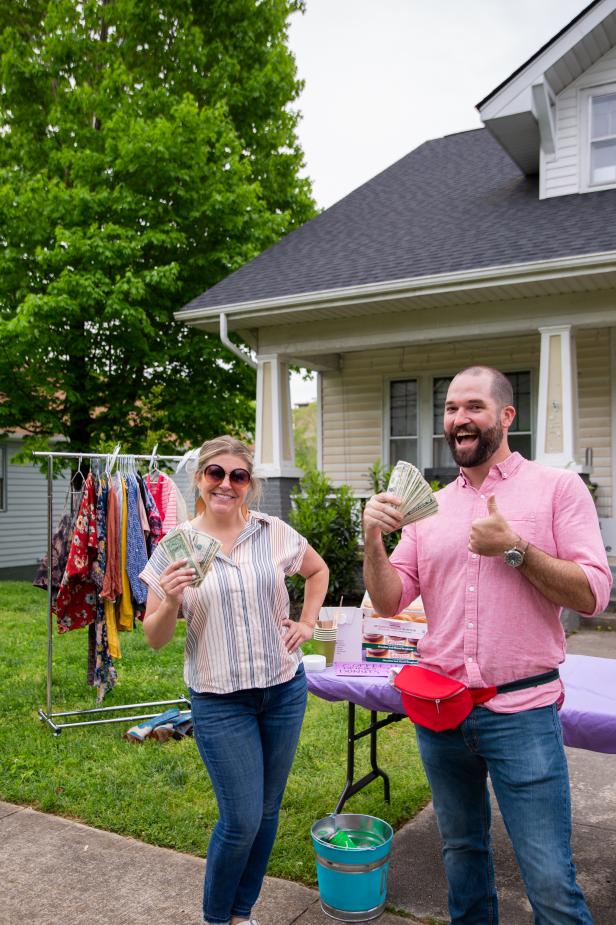 Yard Sale Hosts Smile and Show Off Their Income From Sale