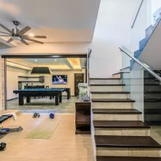 Spacious Home Gym and Game Room in Modern Mansion