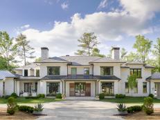 The 2019 Atlanta Homes and Lifestyles Southeastern Designer Showhouse & Gardens is situated on 5 acres in the leafy Buckhead neighborhood. The 12,268  square foot home features Lowcountry inspired elements including painted brick, metal roofing and timber columns and multiple patios with French doors to connect indoors and out.