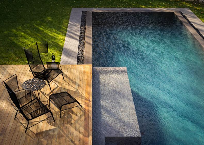 Modern Infinity Pool with Wrought Iron Patio Furniture 
