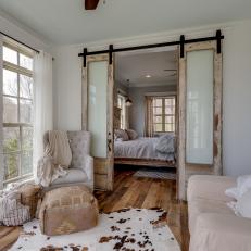 Sitting Area With Barn Doors Outside Bedroom
