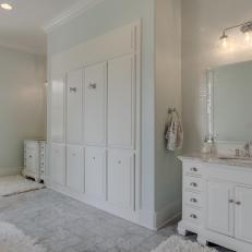 White Master Bathroom With Tile Wall and White Vanity