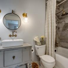 Bathroom With Distressed Gray Vanity and White Vessel Sink