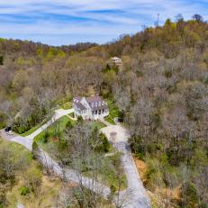 Aerial View of Luxury Farmhouse in Forested Tennessee Hills