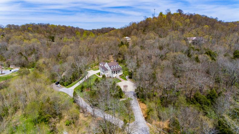 Aerial View of Luxury Farmhouse in Forested Hills of Franklin, TN