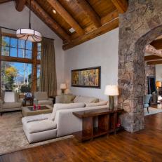 Rustic Sitting Room With Stone Arch