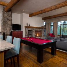 Rustic Game Room With Red Pool Table