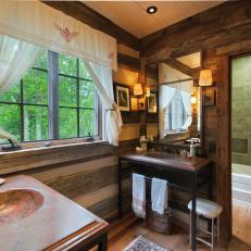 Upscale Log Cabin Bathroom With Console Vanities