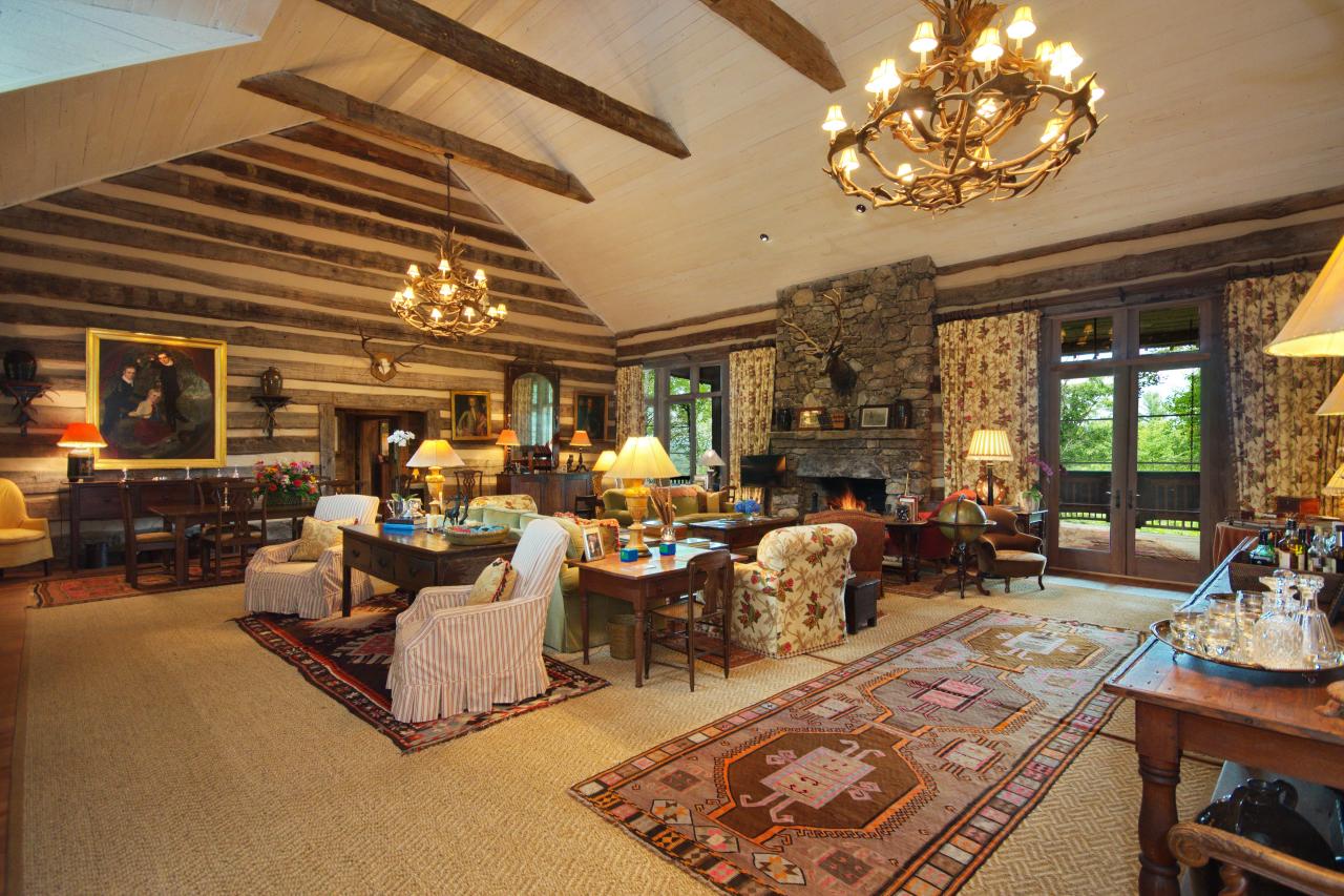 Log Cabin Living Room With High Ceiling And Antler