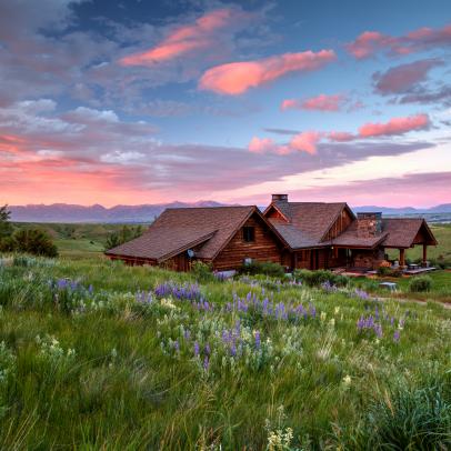Log Cabin Mansion Takes in Montana Sunset View