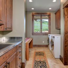 Kitchen and Laundry Area With Stainless Steel Countertop