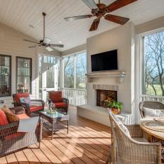 Screen Porch With Red Armchairs