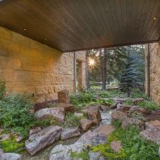 Contemporary Home's Breezeway Is Full of Boulders and Plants