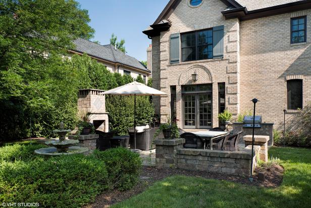 Patio With Fountain and Grill | HGTV